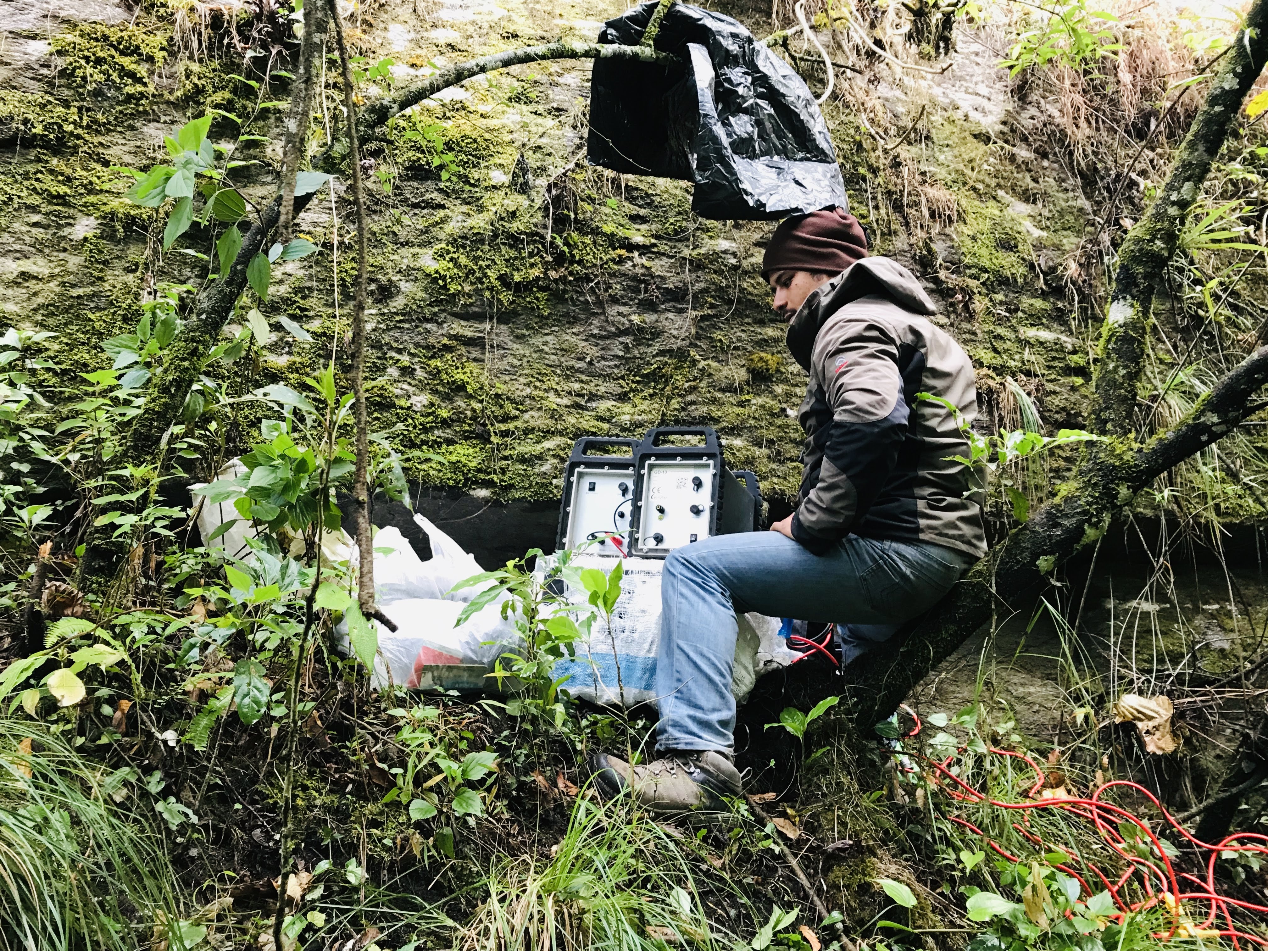 Geophysicist setting up equipment in the Himalayan foothills